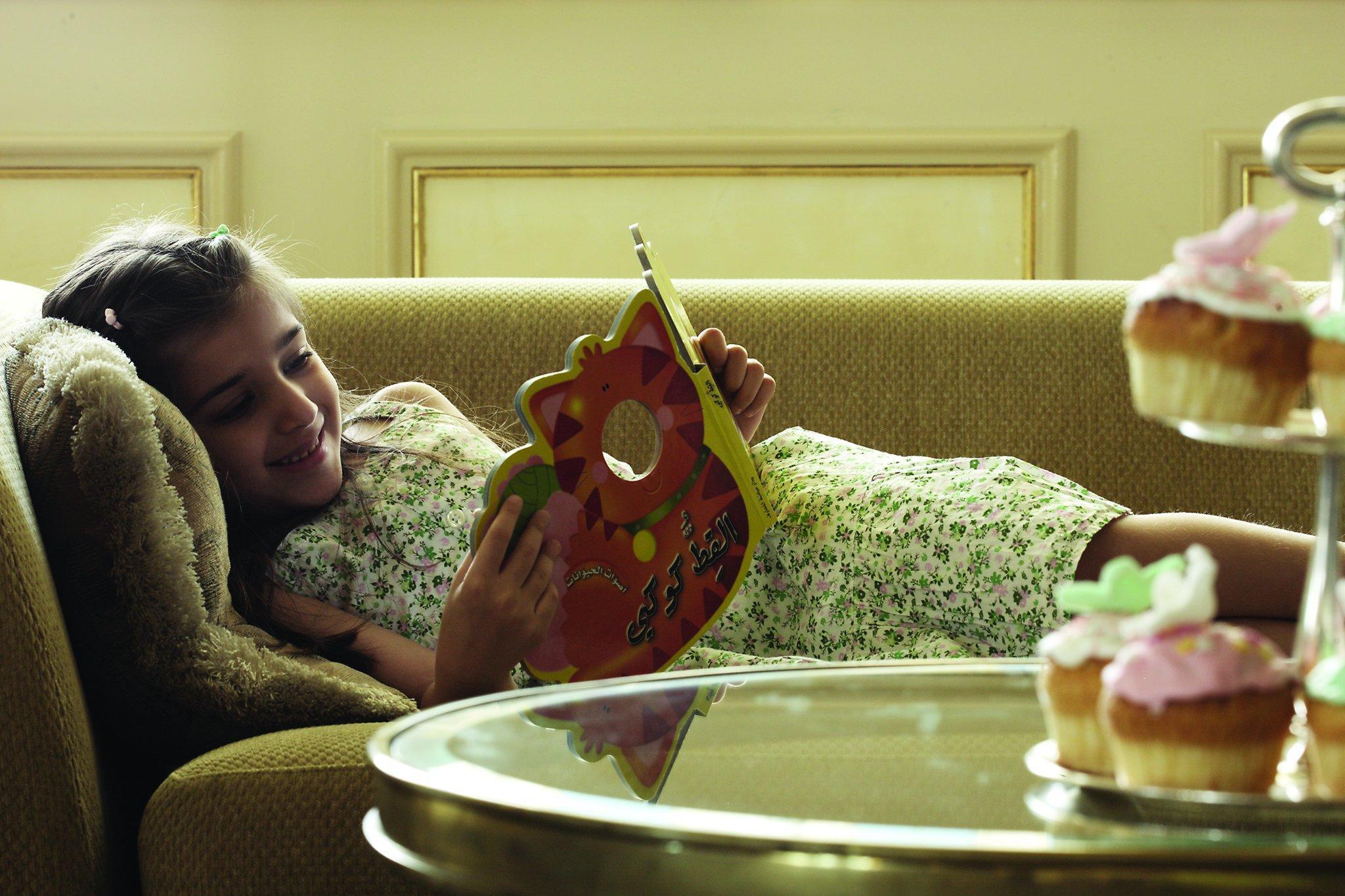 Four Seasons Cairo At The First Residence Giza Luaran gambar A child reading a book